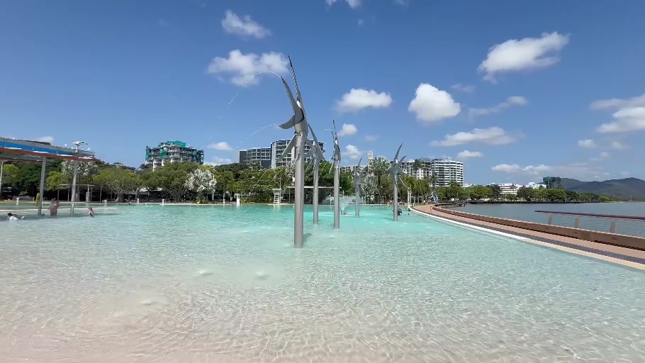 Cairns Lagoon and its fish sculptures beneath a blue sky